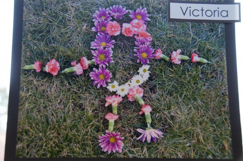 Students described their artwork. About this piece, Victoria said: "It's made out of flowers. It's a flower girl. It's Princess Lei."